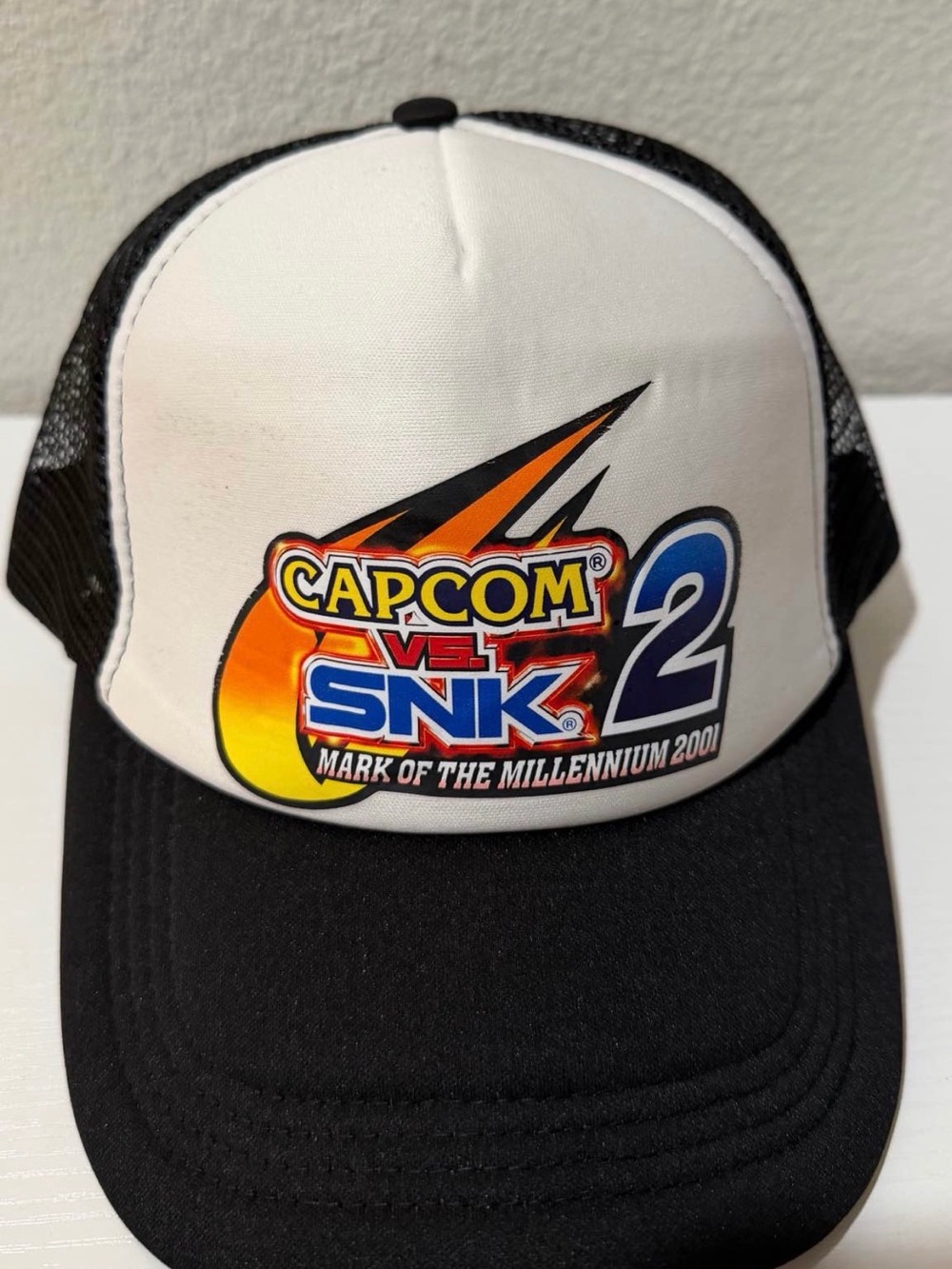 Capcom vs. SNK 2 Trucker Hat — Black & White with Color Logo